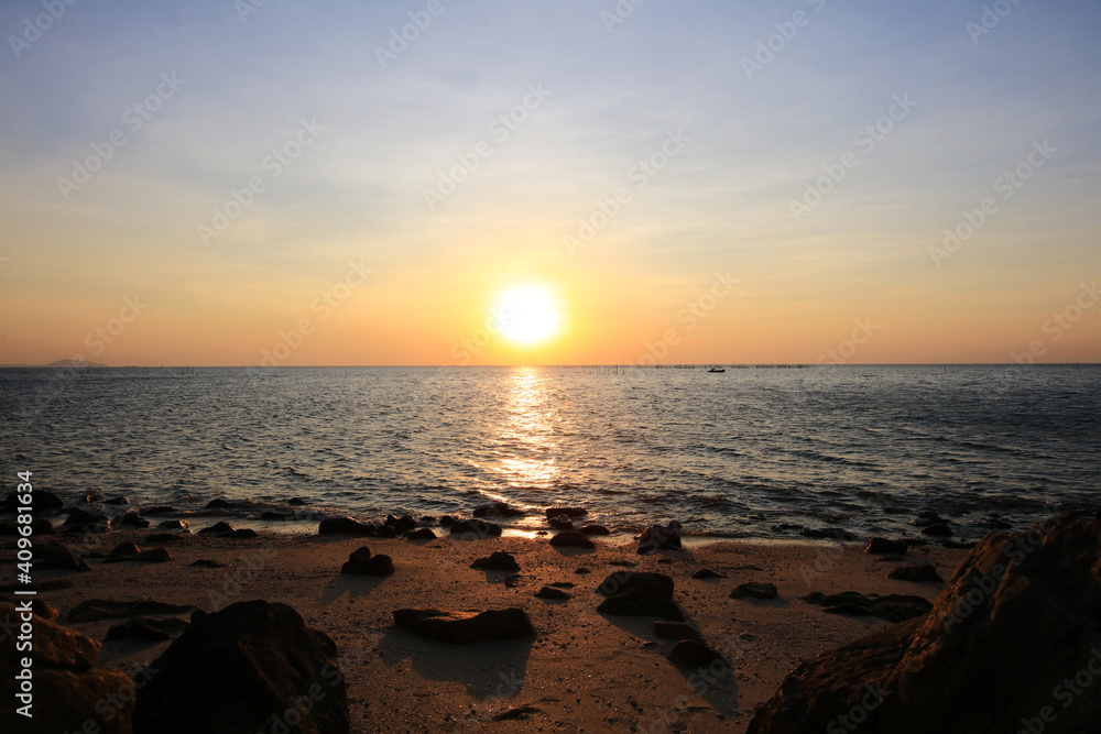 Natural sun set or sunrise over the sea , Sunset on blue ocean, The coast of Bangsean Chonburi, Thailand Natural sun set or sunrise over the sea , Sunset on blue ocean, The coast of Bangsean Chonburi, Thailand