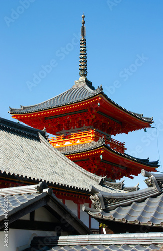 A tower at the red colored Nishimon Temple at Kiyomizudera Temple in Kyoto in Japan