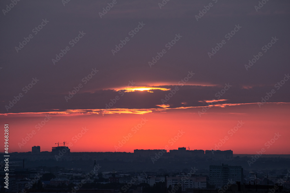 Beautiful orange sunset over the city of Ryazan in summer