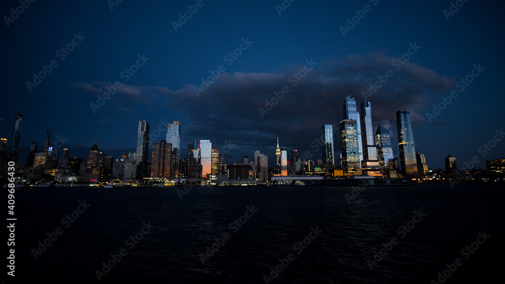 Manhattan skyline night from water