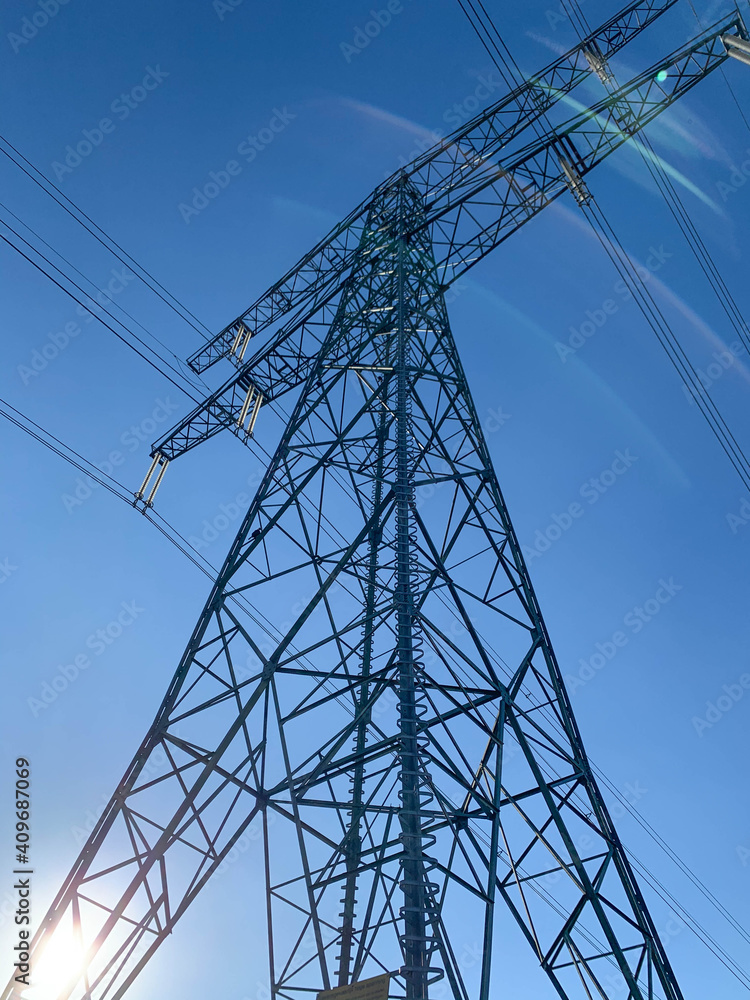 Power tower in front of a clear blue sky Power tower in front of a clear blue sky