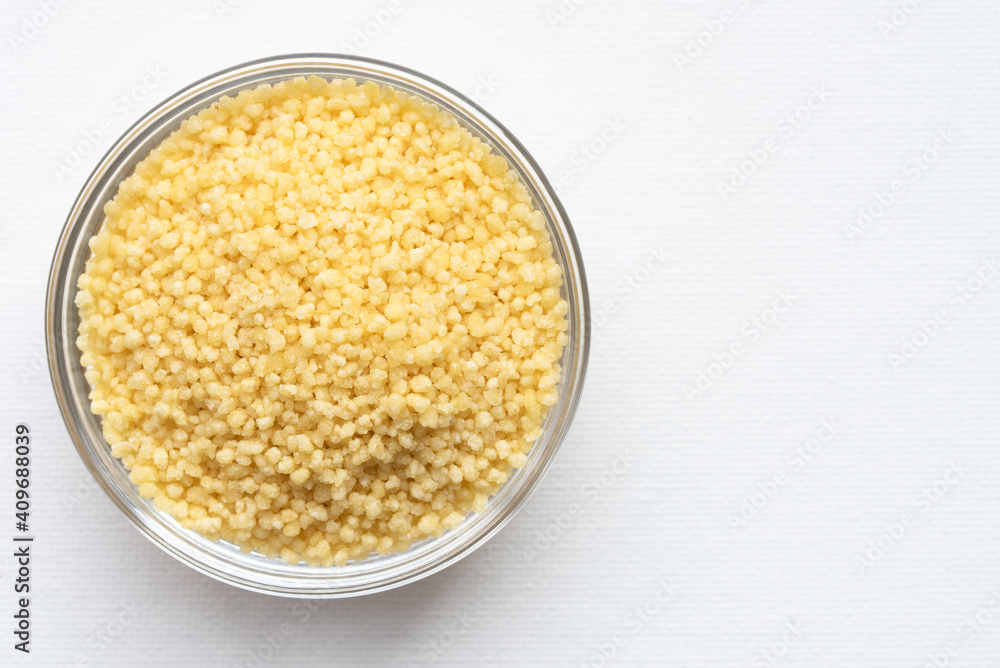 Uncooked French Couscous in a Bowl Uncooked French Couscous in a Bowl