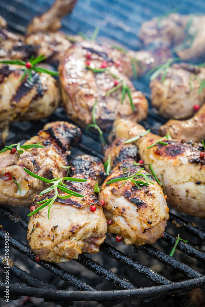 Hot and spicy chicken on grill with spices
