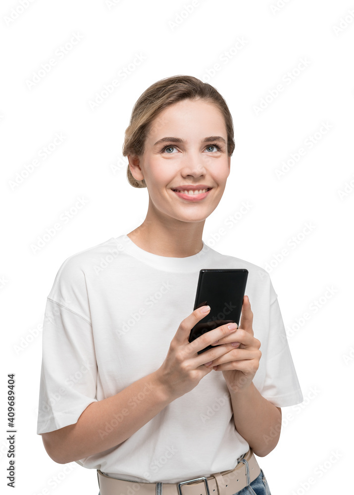Attractive young woman isolated on white background holding smartphone smiling and dreaming about pleasant things Attractive young woman isolated on white background holding smartphone smiling and dreaming about pleasant things