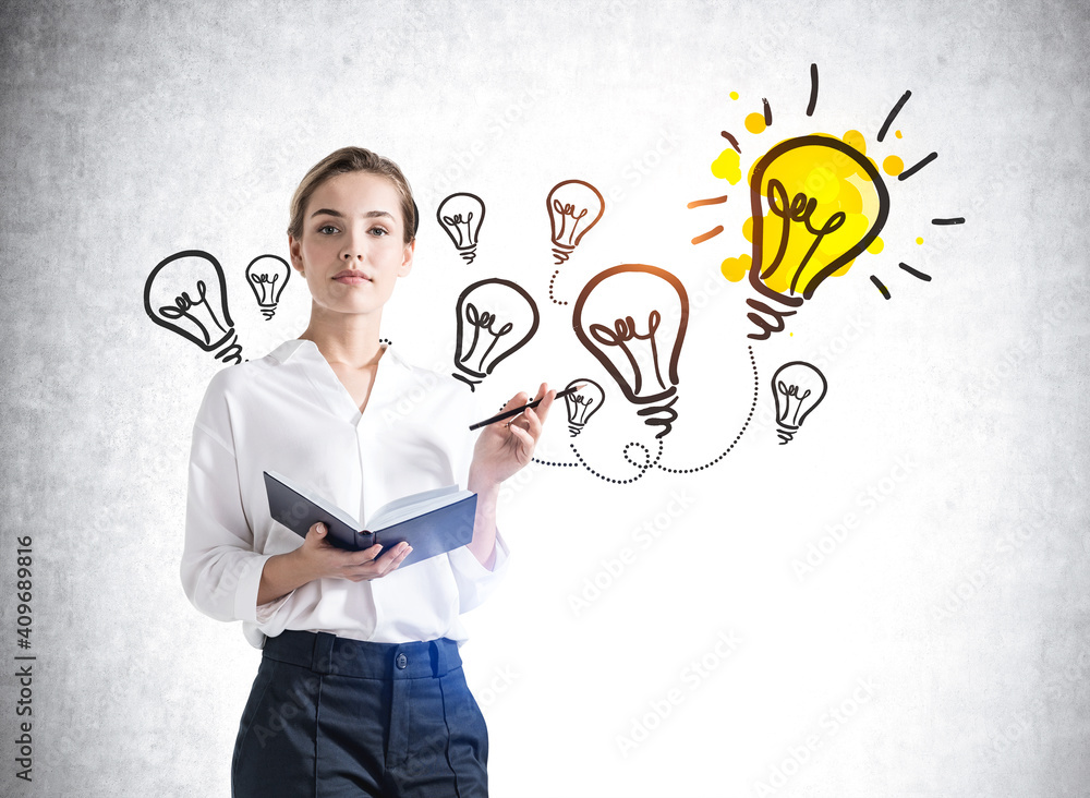 European attractive young woman in formal wear holding planner and pondering near concrete wall with colorful business idea lightbulb sketch drawn on it. Concept of creativity and brainstorming European attractive young woman in formal wear holding planner and pondering near concrete wall with colorful business idea lightbulb sketch drawn on it. Concept of creativity and brainstorming