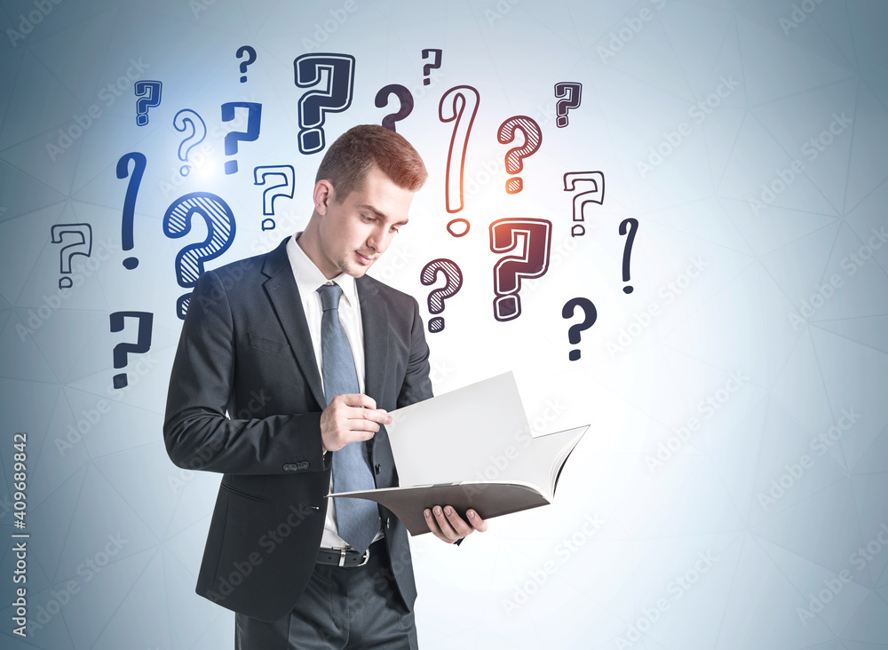 Young businessman with document and question marks Young businessman with document and question marks