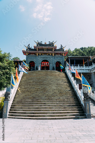 Stone steps with colorful flags at Chih Nan temple in Taipei, Taiwan.