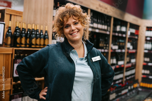 Obraz na plátně Confident liquor store employee
