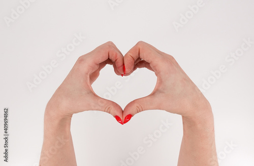 Female hand isolated on white background. White woman s hand showing symbols and gestures. Korean heart finger sign. Asian symbol hand heart. Korean  Chinese and Japanese Symbol hand heart. Love