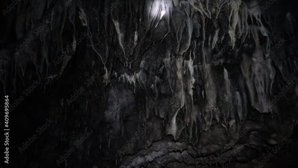Beautiful stalagmite and stalagtite rocks in a cave. Cave explorers. Speleology. Science. Beautiful stalagmite and stalagtite rocks in a cave. Cave explorers. Speleology. Science.