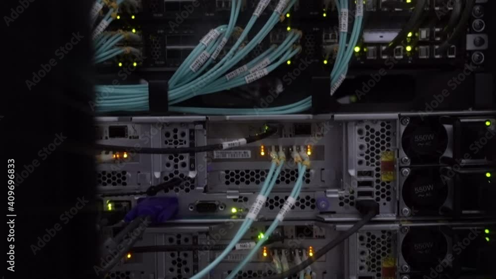Network Provider cables installed in the rack at data center. Fiber optic in server room. Network Provider cables installed in the rack at data center. Fiber optic in server room.
