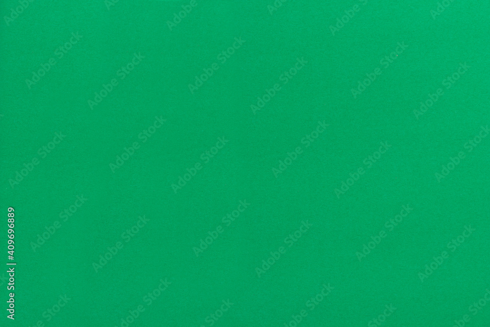 Close up Mottled green paper background and texture. Green paper with stripes of paper. Close up Mottled green paper background and texture. Green paper with stripes of paper.