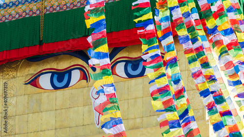 Close up on Buddha eyes on top of the white stupa at Boudhanath, Kathmandu, Nepal