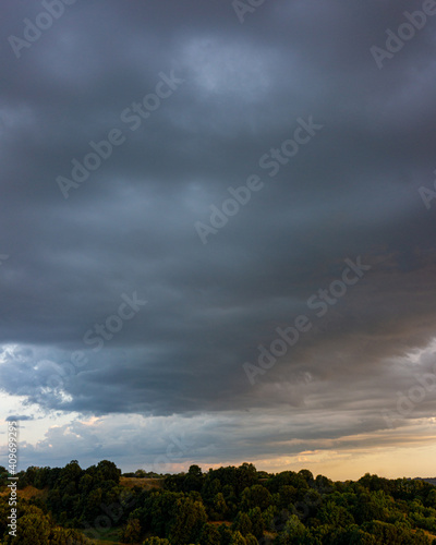 Evening sky and rain clouds, countryside landscape. © APHOTOSTUDIO