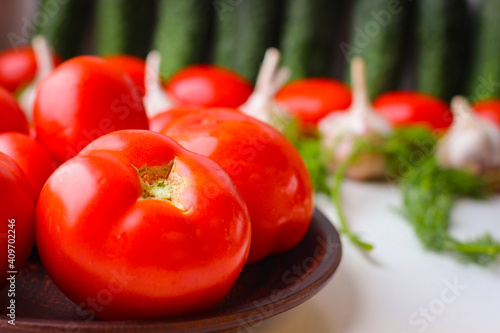 Good organic cucumbers and red tomatoes and garlic