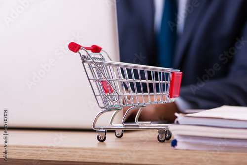 Young male employee in ecommerce concept