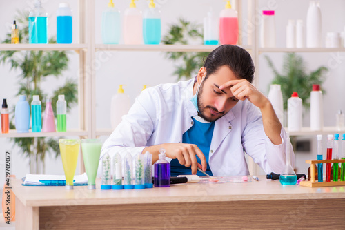 Young male chemist testing soap in the lab