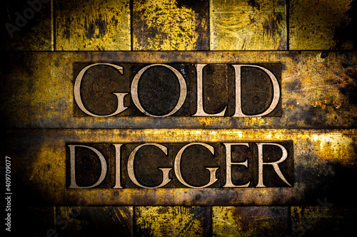Gold Digger text on vintage textured grunge copper and gold background photo
