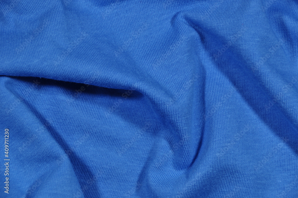 Background, texture. Blue fabric. Pleated fabric, pleats. Background, texture. Blue fabric. Pleated fabric, pleats.