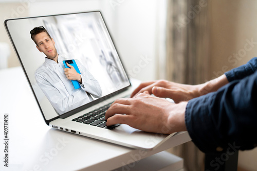 male doctor doing examination on laptop, webcam call online to the patient at home