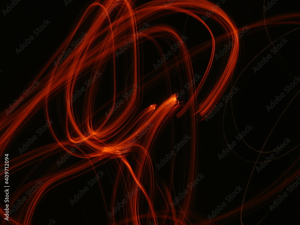Orange, red, flame, fire abstract Neon light lines on black background Orange, red, flame, fire abstract Neon light lines on black background