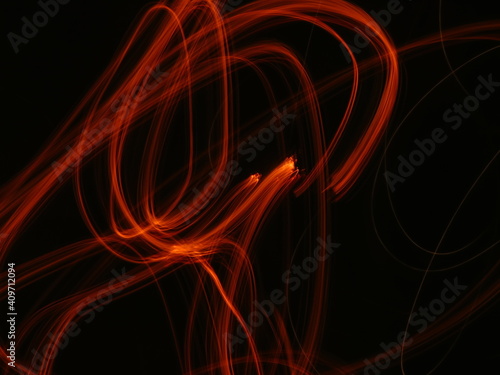 Orange, red, flame, fire abstract Neon light lines on black background