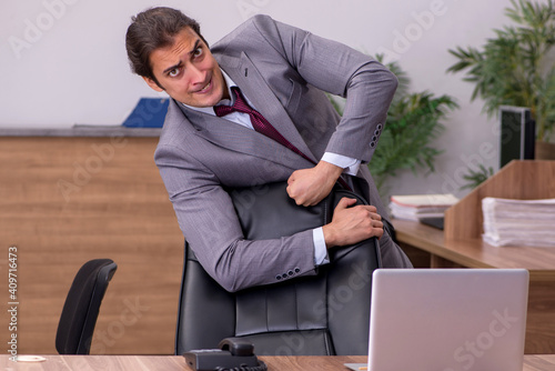 Young businessman employee in bullying concept in the office