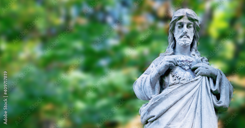 Ancient statue of Jesus Christ. Free copy space for design or text.