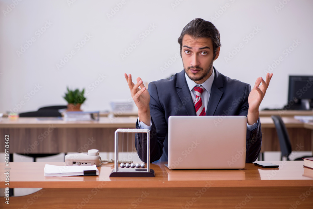 Young man businessman employee sitting in the office Young man businessman employee sitting in the office