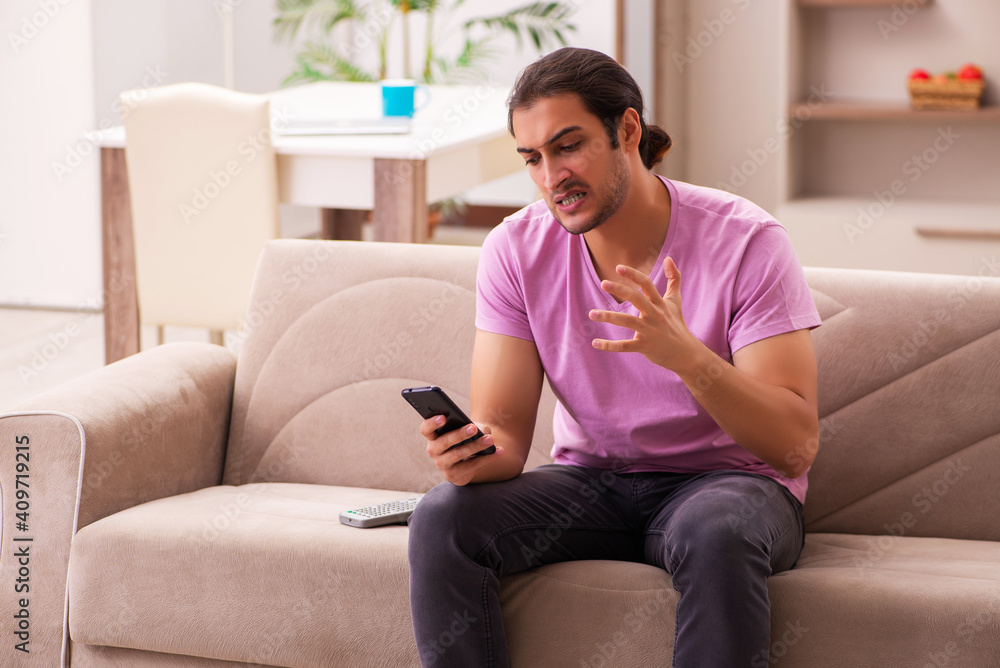 Young man staying at home during pandemic Young man staying at home during pandemic