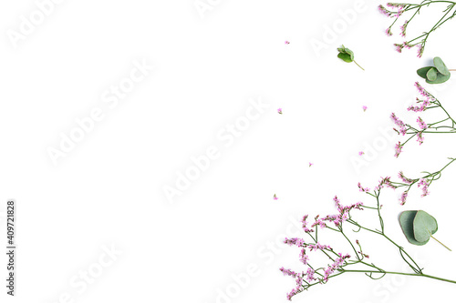 Flowers composition. Frame made of pink gypsophila flowers and eucalyptus branches on white background. Flat lay  top view  copy space