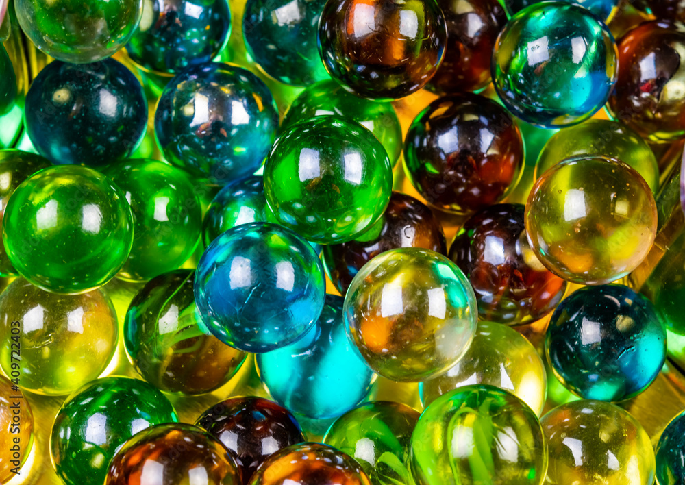 A crystal ball with a reflection. colorful glass balls. Texture background. Close-up macro.