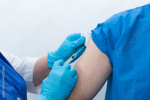 A nurse vaccinates the patient, vaccination