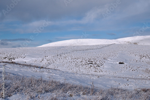 Frozen snow covered mountain landscape of the Ochil Hills in Scotland