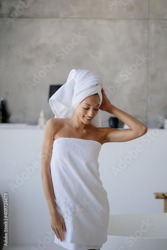 Female model in white towel. Women, beauty and hygiene concept.