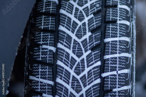 Winter tire tread on a snow-covered road. Driving on winter tires on a snow-covered road