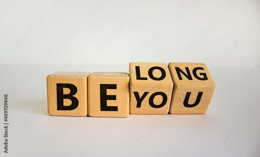 Be you, belong symbol. Turned cubes and changed words 'be you' to 'belong'. Beautiful white background. Business, belonging and be you, belong concept. Copy space. Be you, belong symbol. Turned cubes and changed words 'be you' to 'belong'. Beautiful white background. Business, belonging and be you, belong concept. Copy space.