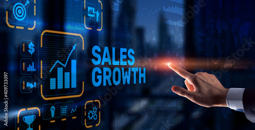 Sales Growth Man clicks inscription on virtual 3D screen.