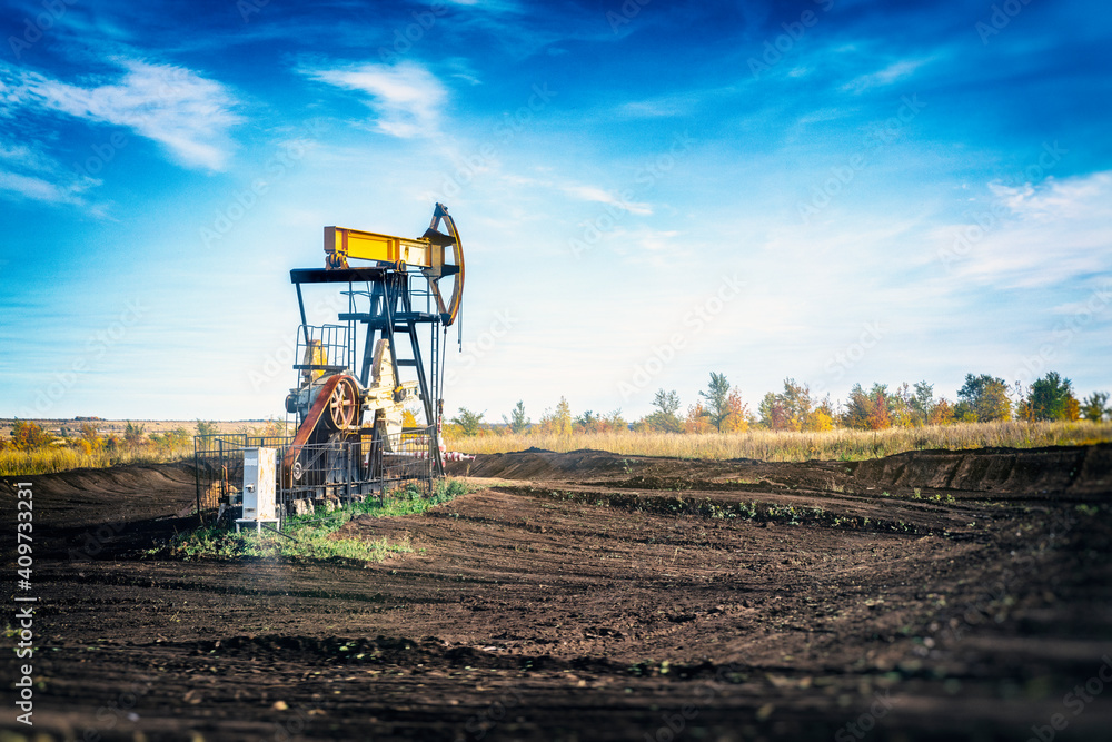 oil pumping station in the field against the sky, blurred image oil pumping station in the field against the sky, blurred image