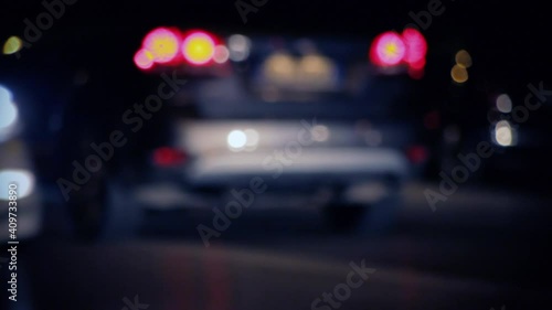 The traffic lights from cars moving on a busy street at night. Nice blurred spots.
