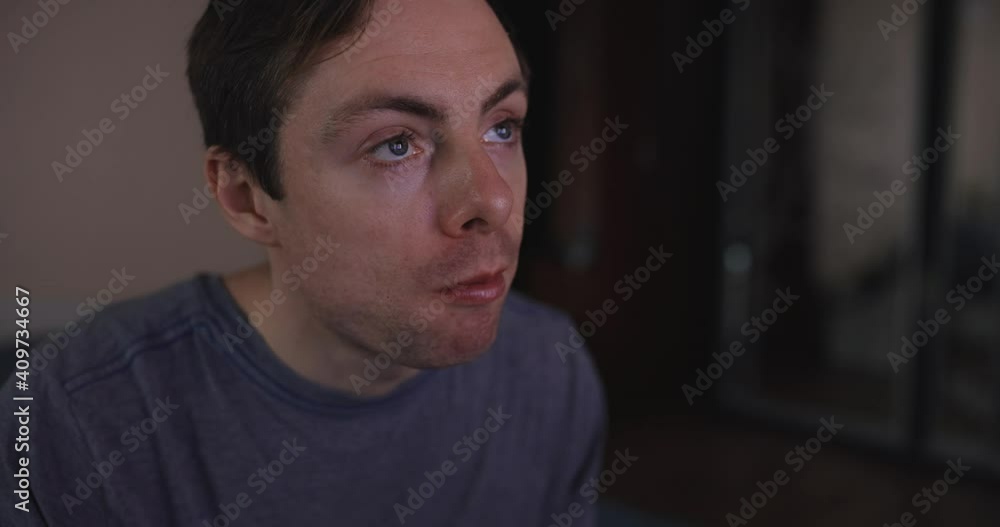 Young man eats pasta and watches tv at home Young man eats pasta and watches tv at home