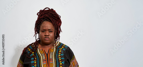 Canvas Print Angry plump young african american woman looking at camera