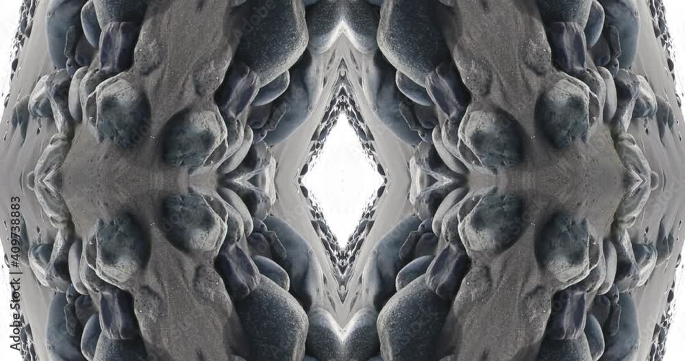 Kaleidoscopic sea landscape with stone. Mirror side effect for natural abstract footage Kaleidoscopic sea landscape with stone. Mirror side effect for natural abstract footage
