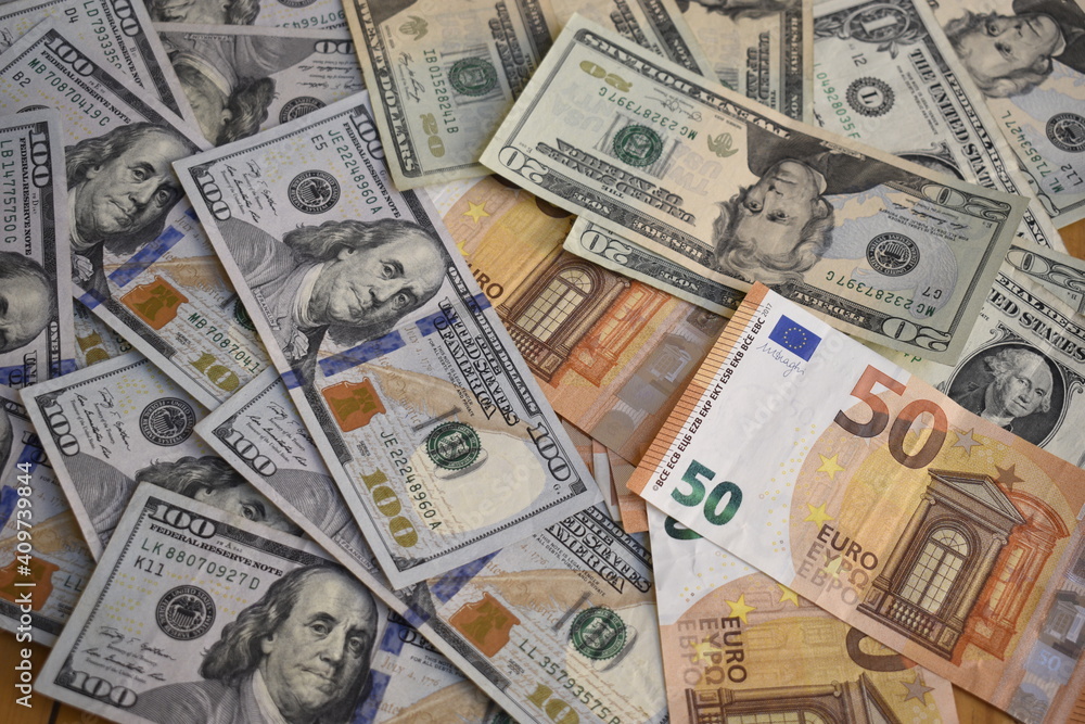banknotes of dollars and euros in disorder
banknotes of dollars and euros in disorder