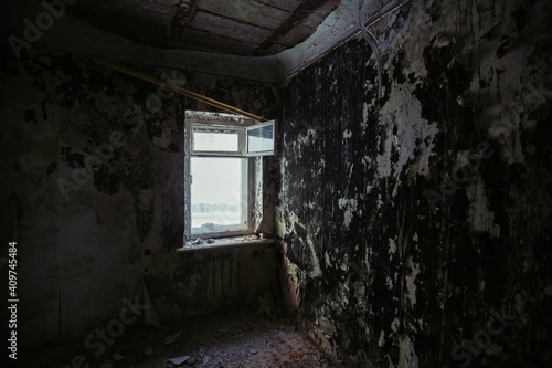 Interior of messy dirty room at old abandoned building