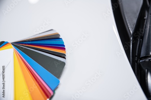 Fotografie Man choosing color of his car with color sampler