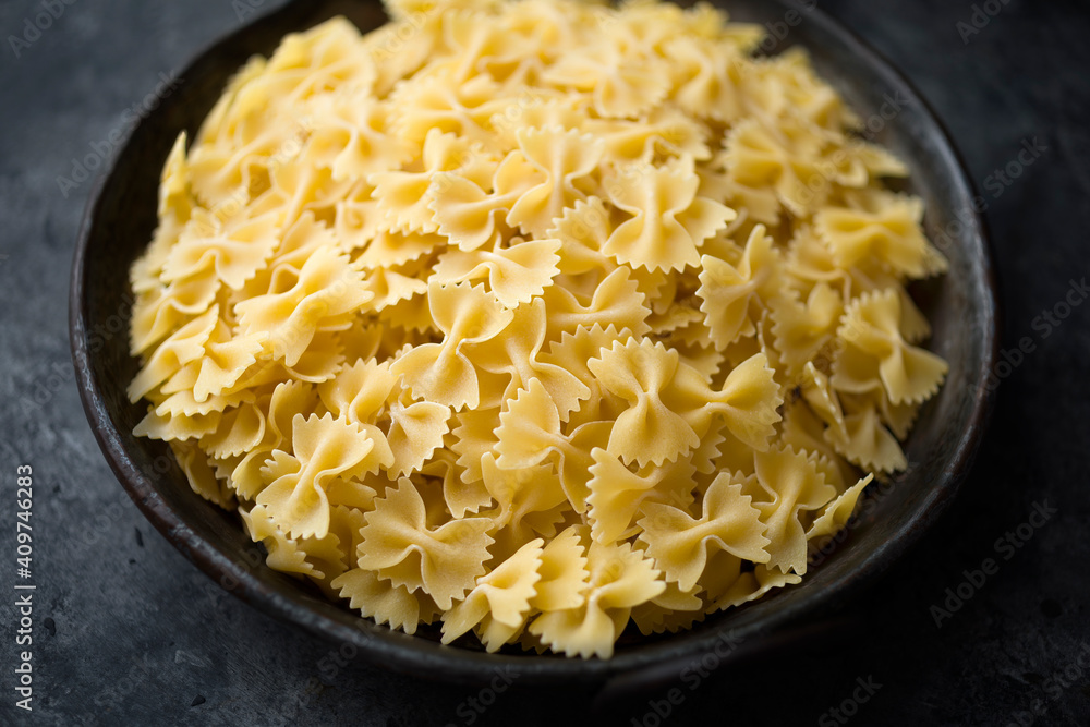 italian farfalle pasta raw uncooked blur defocused italian farfalle pasta raw uncooked blur defocused