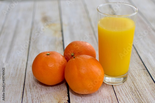 Fresh oranges and organic hand squeezed orange juice. Concept simple whole food, fresh fruit background close-up with copy space photo isolated ingredient