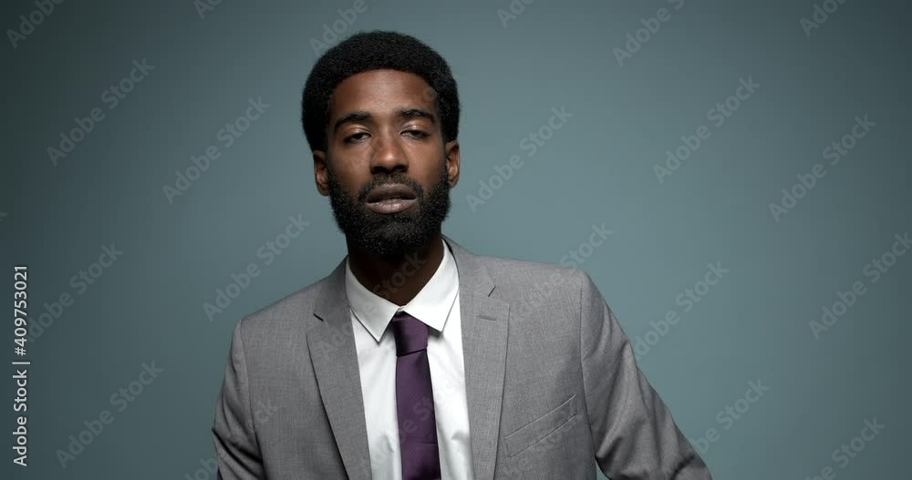 Beautiful happy handsome man with facial expressions in front of a colored background Beautiful happy handsome man with facial expressions in front of a colored background