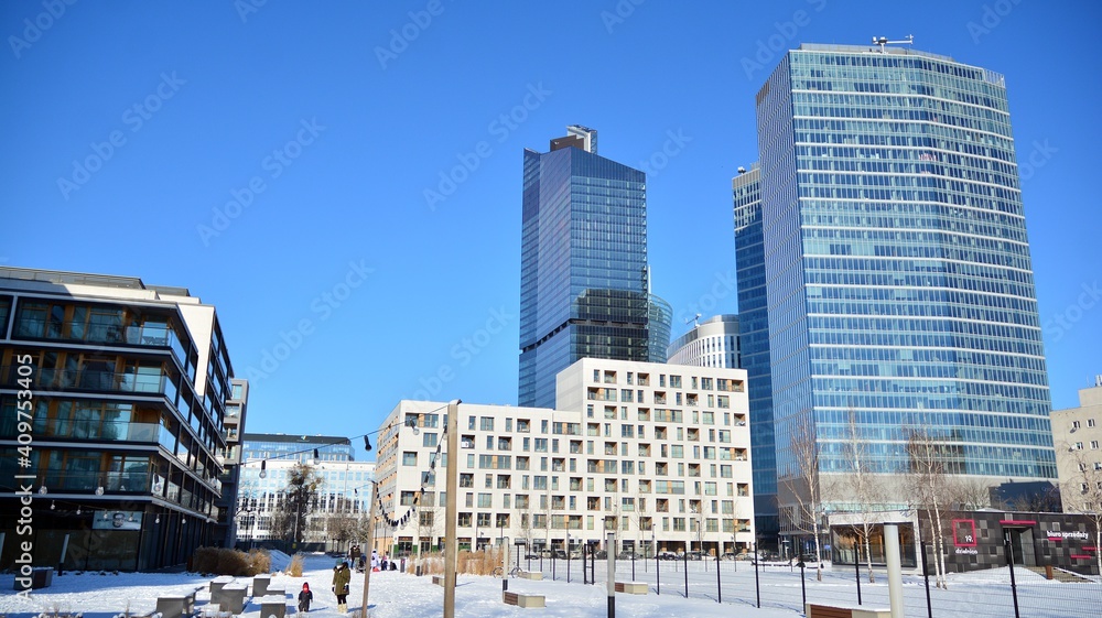 View of skyscrapers during snowfall.Urban cityscape and modern architecture background. 